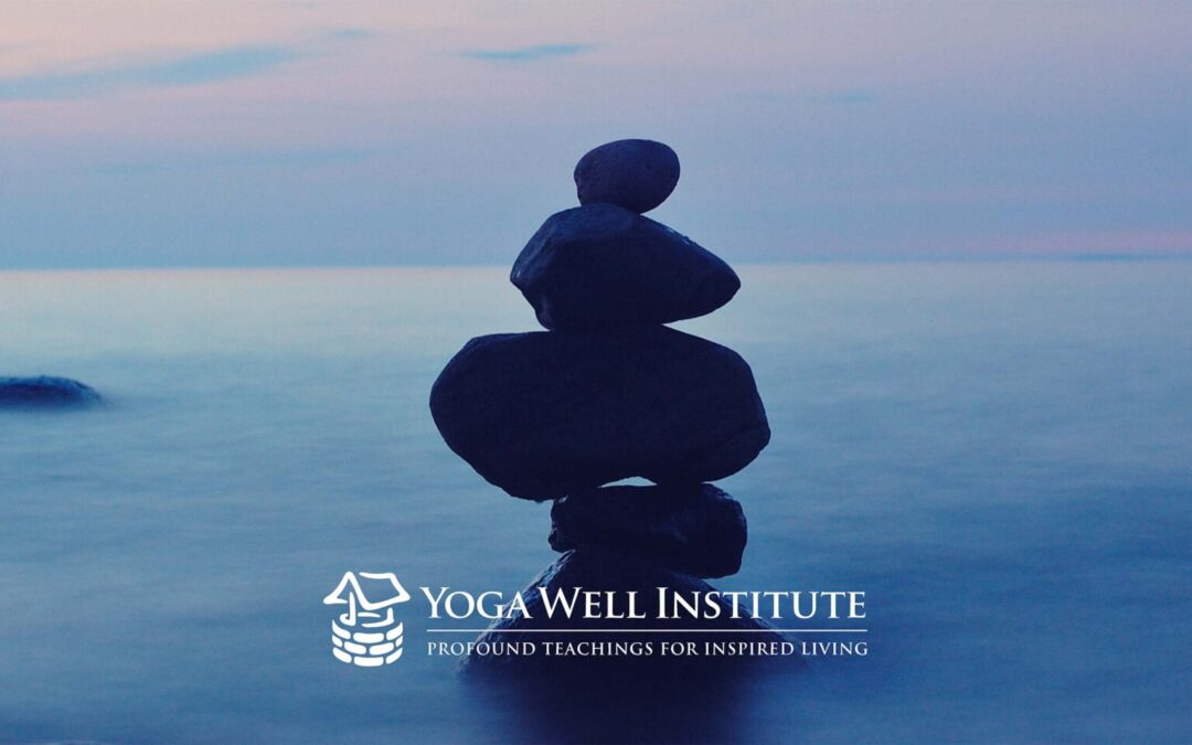 Stones in a blue background with the Yoga Well Institute logo over it