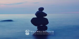 Stones in a blue background with the Yoga Well Institute logo over it